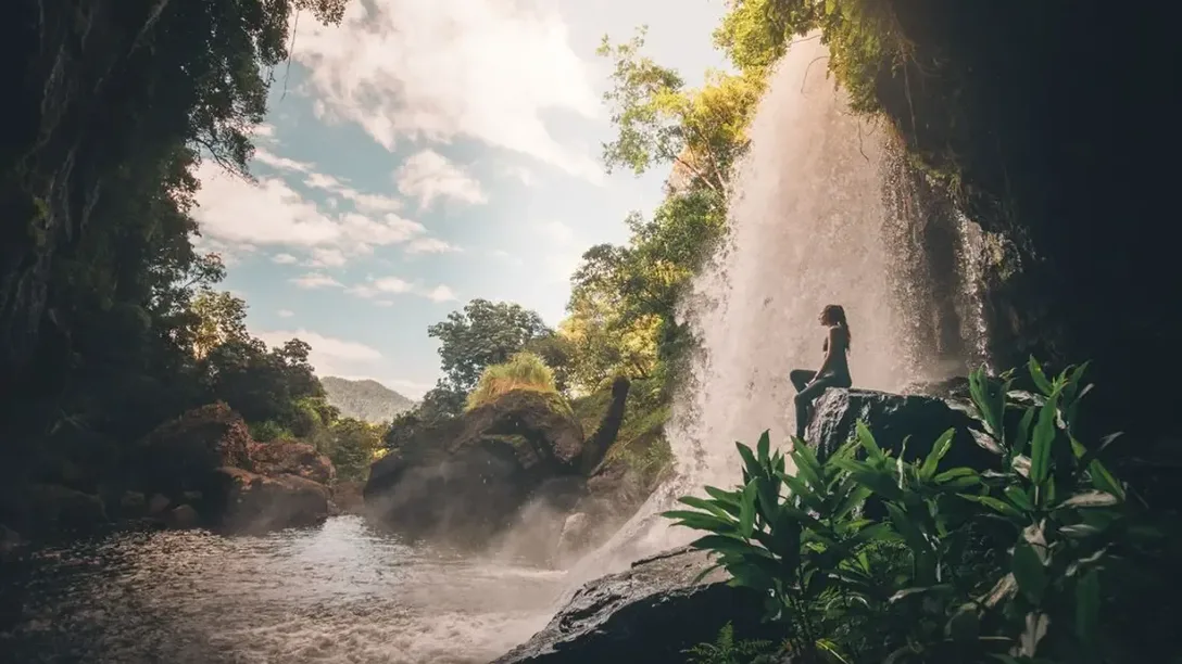 Intrepid Australia QLD Cairns Atherton Tablelands waterfall rainforest hiker Getty Images 1252871094